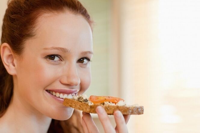 A girl with a sandwich